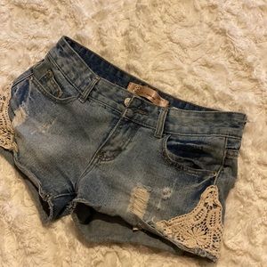 Ripped lace denim shorts